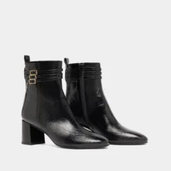Bottines détaillées de boucles