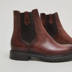 Bottines à semelles crantées et élastiques