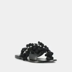 Mules à pompons et perles